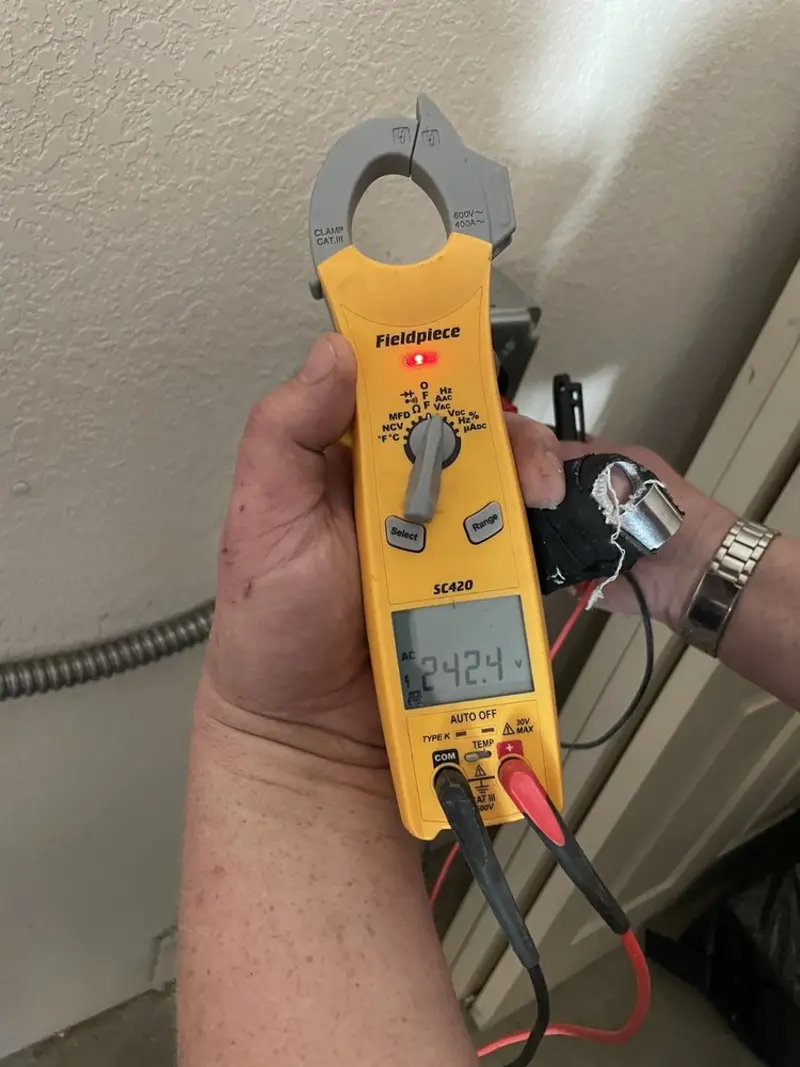 Voltage testing with clamp meter during Generator Installation in Fredericksburg
